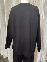 Load image into Gallery viewer, Malissa J WF2555 Black PU Top with long sleeves and PU-trim pockets-women’s neutral longline top with eyelet detail.
