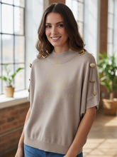 Load image into Gallery viewer, Malissa J WF2648 stone high neck knit jumper with gold button detail – women’s chic knitwear, versatile autumn winter jumper for smart-casual and evening outfits.
