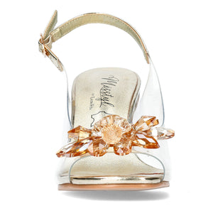 A pair of gold-colored heels with ankle straps