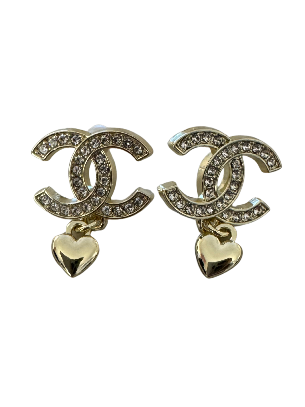 Nouvelle CC Gold Earrings featuring crystal-embellished interlocking design with a dangling gold heart charm, perfect for adding sparkle and elegance to any outfit.