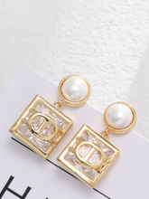 Load image into Gallery viewer, PCHA EUR576 Gold Pearl &amp; Crystal Earrings featuring gold-tone square crystal drops with pearl studs, perfect for elegant and occasion styling.
