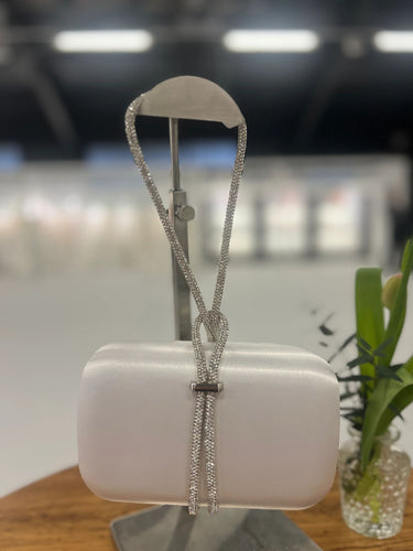 White satin evening clutch with sparkling rhinestone strap - elegant women’s occasion bag for weddings, parties and special events.
