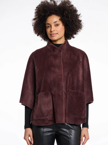 Rino & Pelle Faux-Fur Cape in plush soft finish with snap button closure, pockets and side slit details – elegant women’s evening and winter cape.