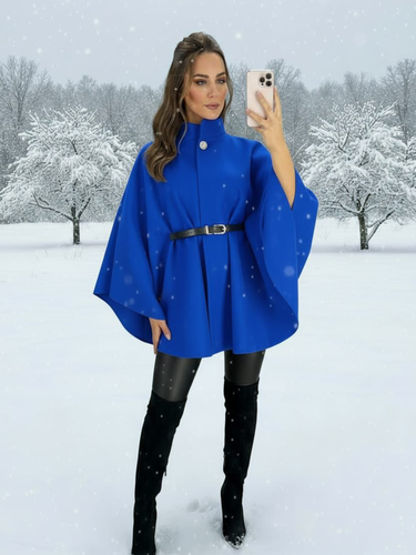 The QBAW25 RR Royal Blue Carrie Cape features a structured silhouette with wide sleeves, a high neckline and elegant gold button detailing. Finished with a detachable belt for a flattering fit, this chic cape blends timeless tailoring with modern sophistication - perfect for layering over seasonal outfits.